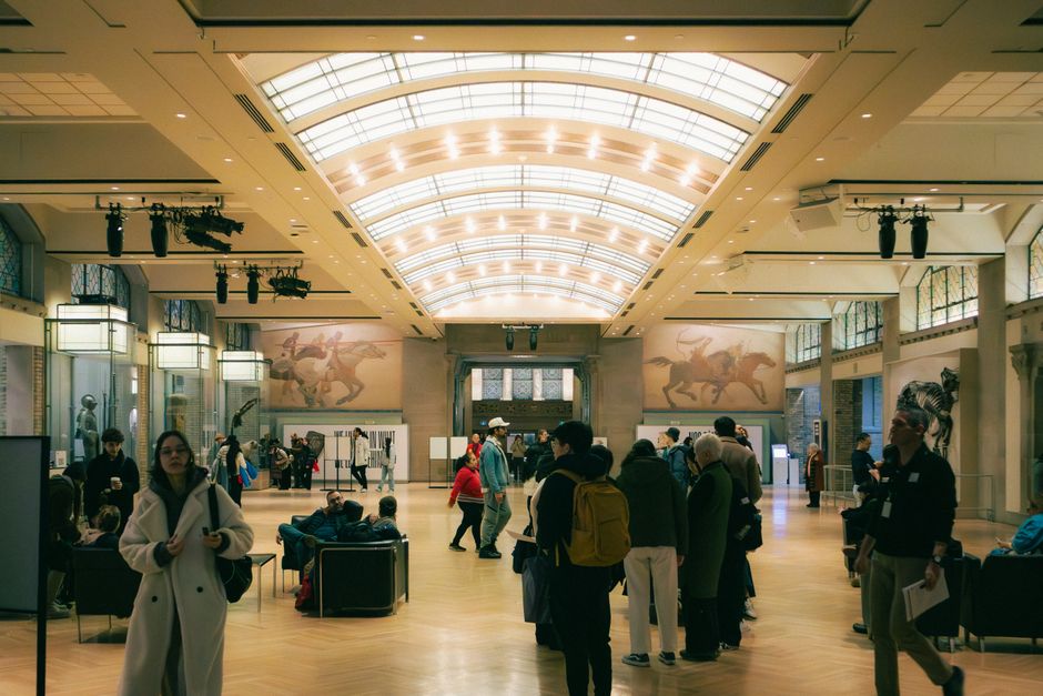 People exploring an art museum exhibit in Toronto, Ontario, Canada.